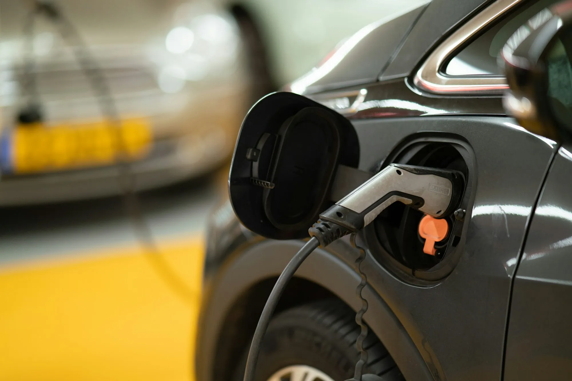 A charging connector attached to a vehicle