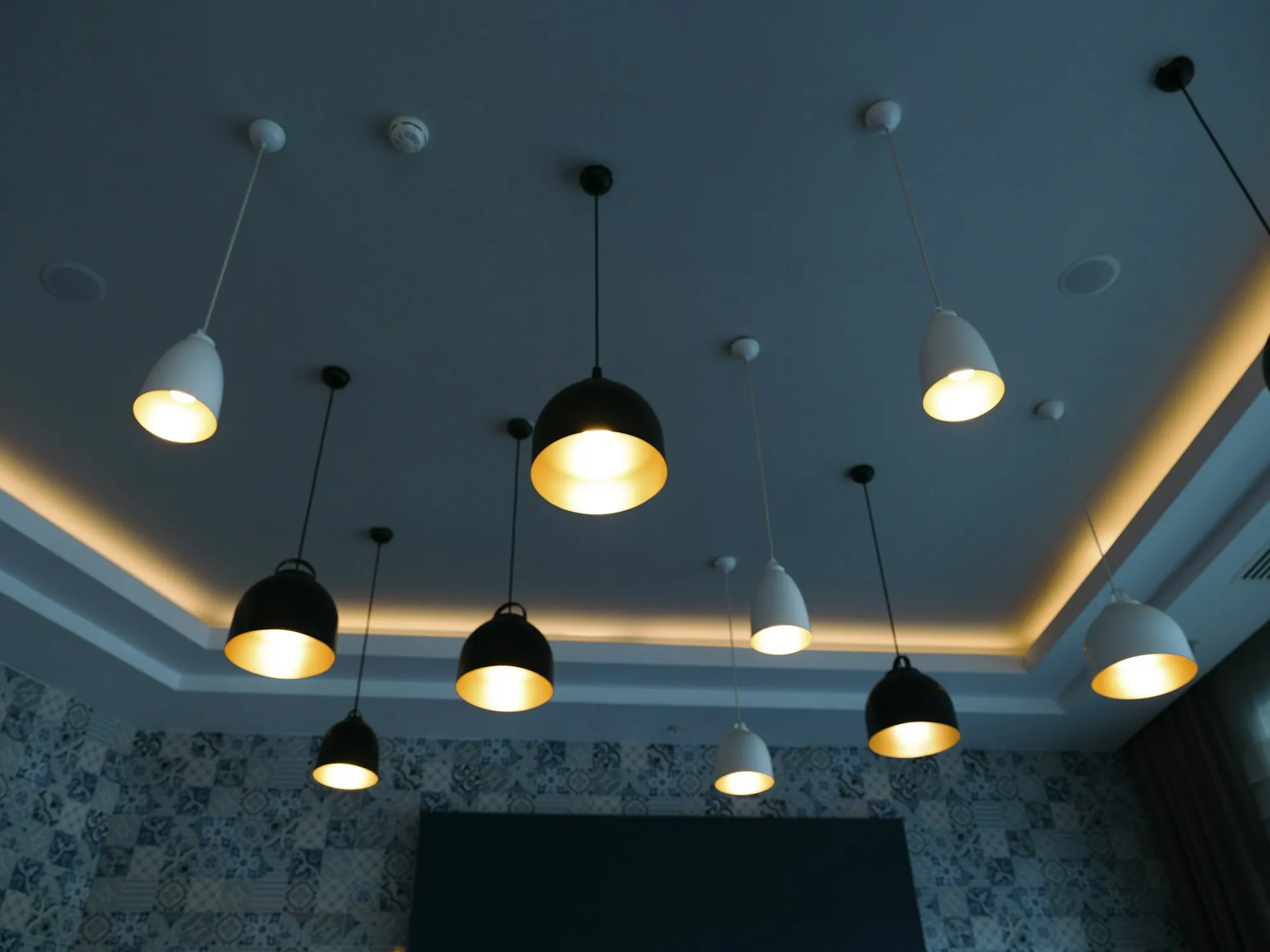 Pendant lights above a dining area