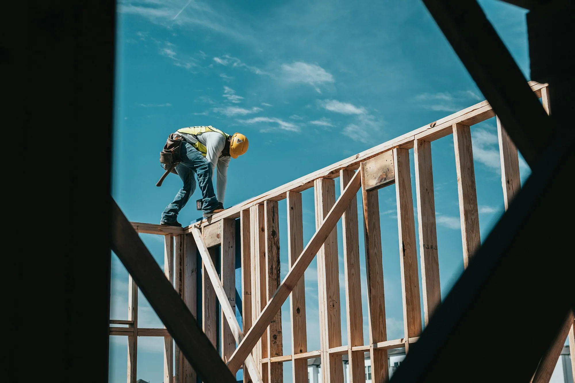 A carpenter working on timber framing